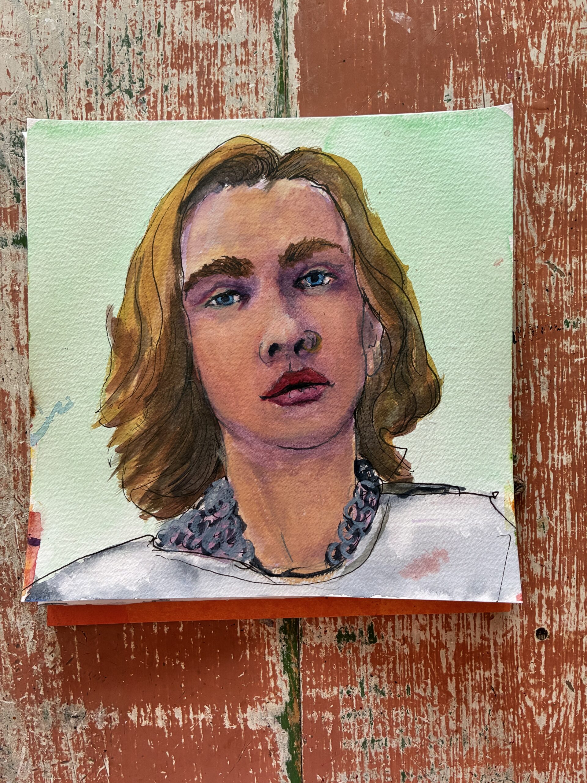 A watercolor painting of a woman in chain mail with fair skin and blonde hair